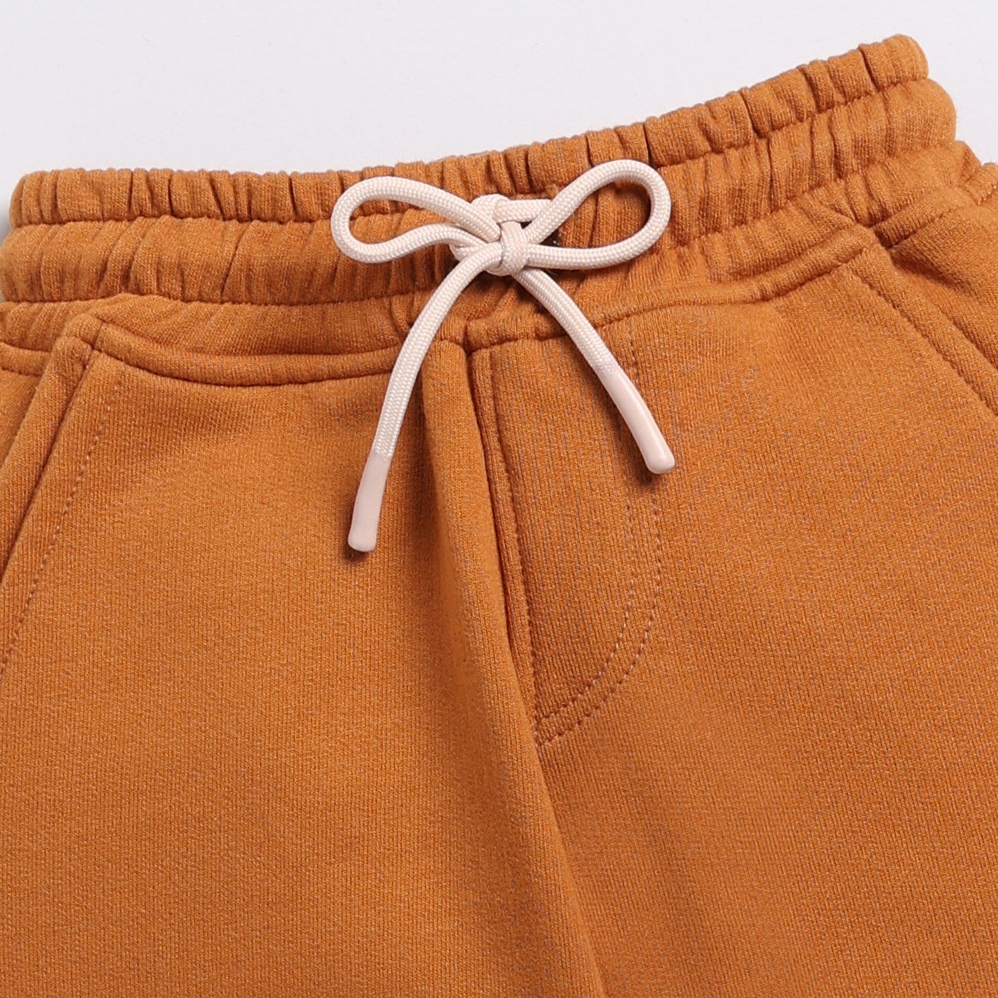Shop pumpkin spice color organic fleece relaxed jogger for your 3 months to 5 years baby - CotandCandyBaby