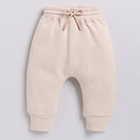 Load image into Gallery viewer, Get almond peach color organic fleece relaxed jogger for your 12-18 months baby - CotandCandyBaby
