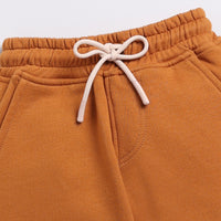 Load image into Gallery viewer, Shop pumpkin spice color organic fleece relaxed jogger for your 3 months to 5 years baby - CotandCandyBaby
