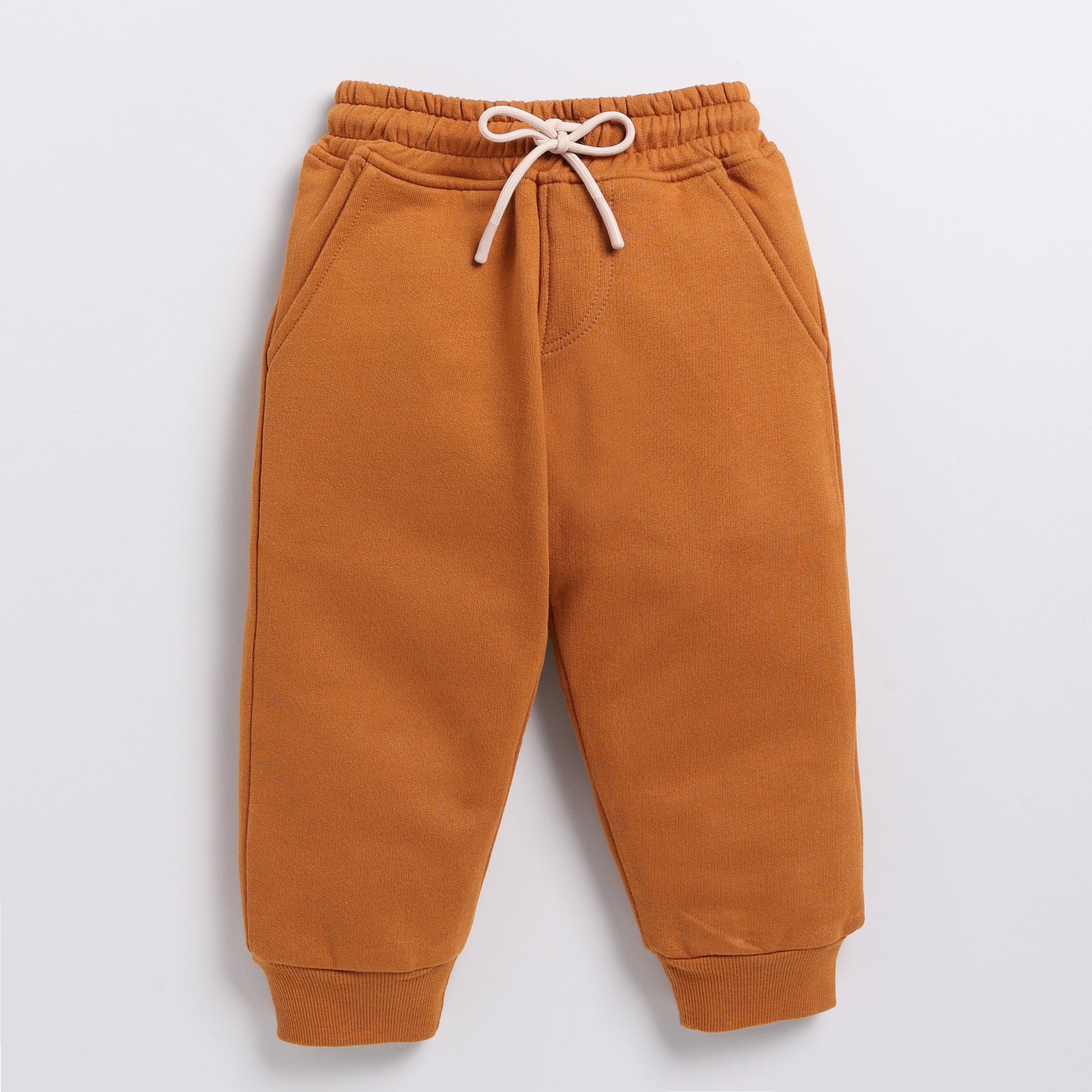 Shop pumpkin spice color organic fleece relaxed jogger online for your 4-5 years baby - CotandCandyBaby