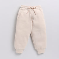 Load image into Gallery viewer, Buy almond peach color organic fleece relaxed jogger online for your 3-4 years baby - CotandCandyBaby
