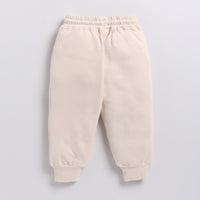 Load image into Gallery viewer, Shop almond peach color organic fleece relaxed jogger online for your 4-5 years baby - CotandCandyBaby
